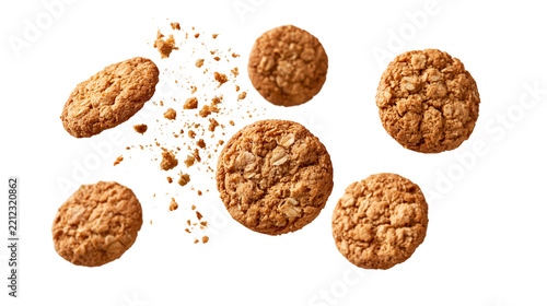 Crispy golden brown oatmeal cookies with scattered crumbs