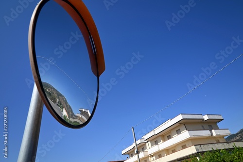 Convex Traffic Mirror Reflecting the Street and Sky