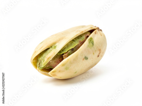 This is a pistachio nut with its seed still intact. It is a natural product and can be consumed as a snack or used in various culinary dishes.
