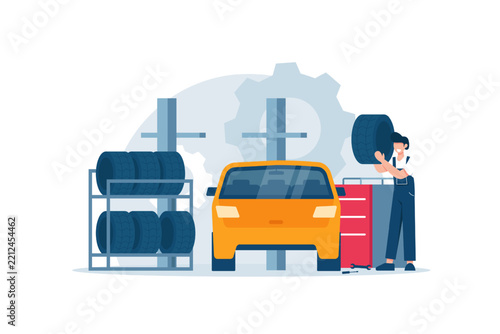 Car repair,man changing wheels in garage,Concept of tire fitting