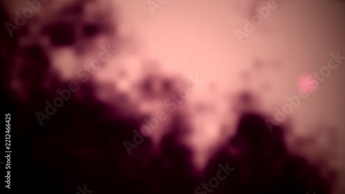 Abstract dark purple smoke rising across hazy peach background creating soft textured atmospheric visual effect and copy space