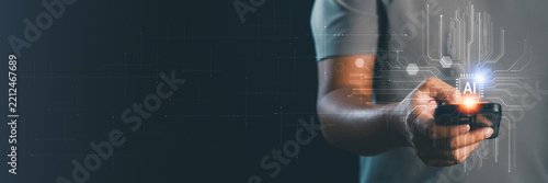 A businessman using a smartphone to interact AI circuit board. Artificial intelligence, digital, innovation, future tech and data management. Technology background banner and copy space