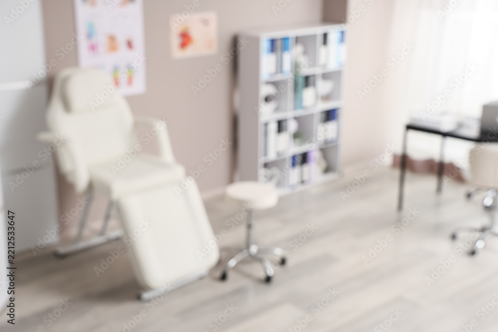 Fototapeta premium Medical clinic interior, healthcare facility and wellness center with examination chair and professional equipment in a modern doctor office background