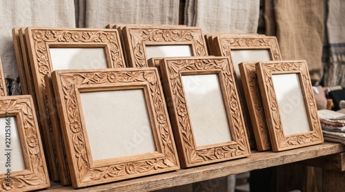 Hand carved wooden picture frames, Artisan woodcraft at market, Decorative empty frame collection, Traditional carved home decor, Handmade market merchandise