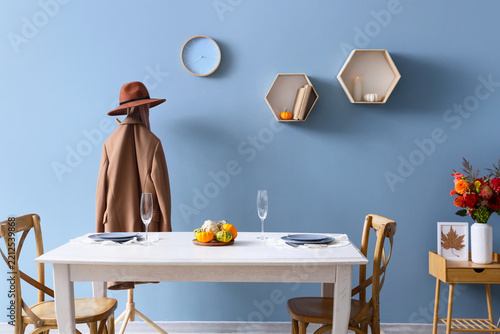 Autumn home interior, cozy dining room decor with seasonal pumpkins and fall ...