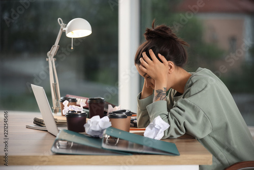 Burnout and workplace stress, exhausted woman working late on laptop with dea...