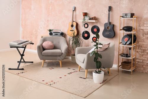 Music studio interior and creative hobby space, cozy living room with guitars...