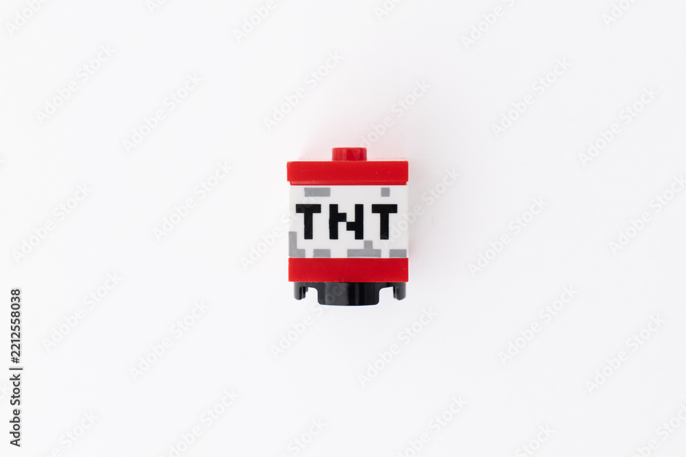Naklejka premium Lego Minecraft TNT block shot isolated on a white background with room for copy space. Bradford, UK Oct 2 2026
