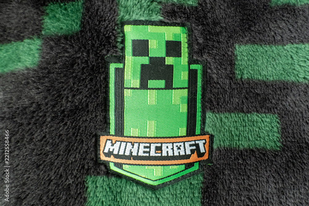 Naklejka premium A Minecraft creeper fabric badge on black and green creeper fleece material. Bradford, UK Oct 2 2026