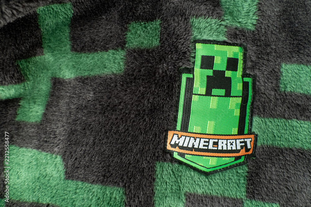 Naklejka premium A Minecraft creeper fabric badge on black and green creeper fleece material. Bradford, UK Oct 2 2026