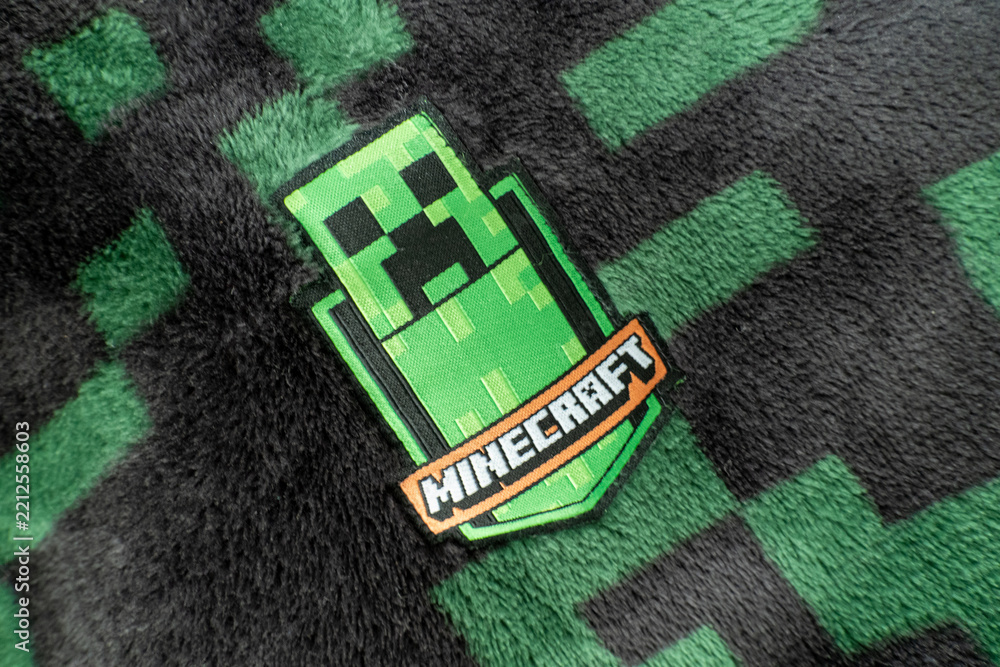 Naklejka premium A Minecraft creeper fabric badge on black and green creeper fleece material. Bradford, UK Oct 2 2026
