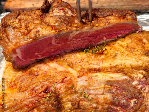 Sliced medium rare roast beef with crispy roasted crust
