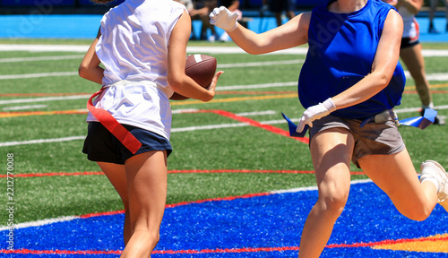 Youth Players Engaging in Girls Flag Football Game