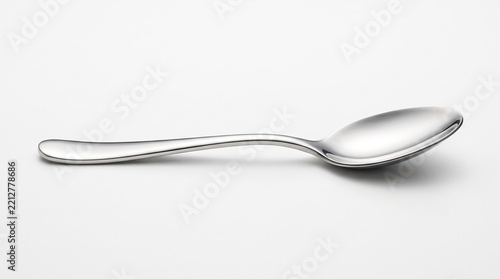 Stainless steel spoon on white background, clean product photography, sharp focus, 4K.
