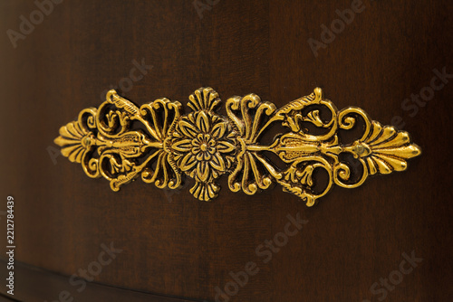 Golden furniture ornament close up