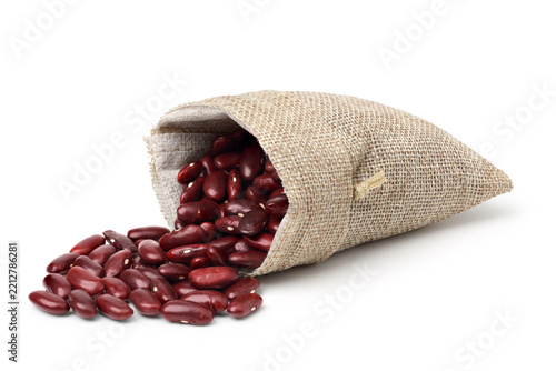 Red beans in a jute sack. isolated on white background.
