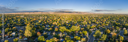 Fort Collins and foothills of Rocky Mountains in Colorado - aerial panorama of early fall morning scenery