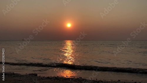 Sunset footage, view of calm ocean waves in the late afternoon.