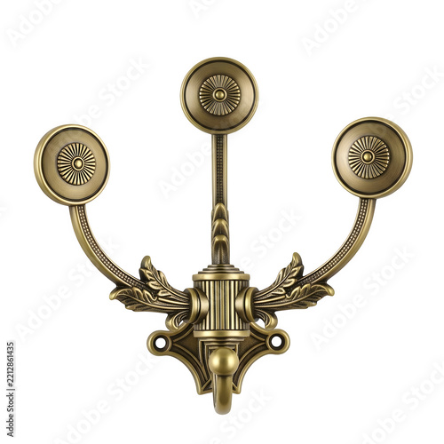 Antique brass wall hook with decorative floral motifs isolated on white