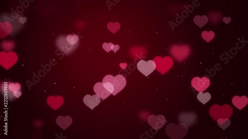 Red hearts bokeh floating upwards on dark crimson background for romantic valentine day video backdrop.