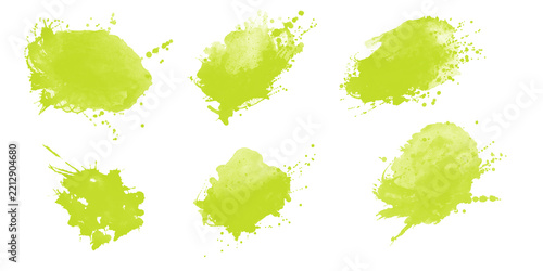 Set of six lime green watercolor paint splatters and artistic ink splashes with paint splatter