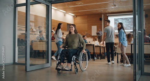 Happy disabled university student in wheelchair entering modern lecture hall classroom door.