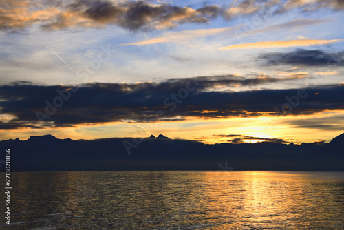 Sunrise over Lake Geneva with mountain reflections in Lausanne, Switzerland, January 4, 2020