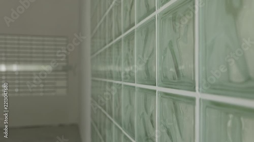 Translucent glass block partition wall in modern building interior