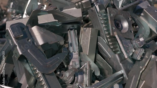 Pile of metal formwork clamps and fastening components for construction