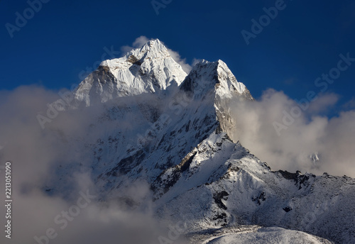 Majestic himalayan summit with clouds