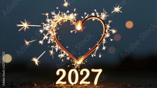 Sparkler heart and 2027 glow against a dark night sky, symbolizing new beginnings.
