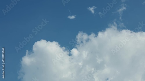 White Clouds Drifting Across Blue Sky on a Clear Day