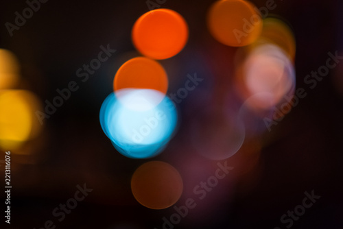 Fotografie Lens bokeh caused by close focusing on lights in a neighborhood bar restaurant t