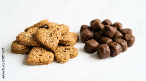 Heart shaped cookies and chocolate balls on a white background Sweet treats healthy snacks