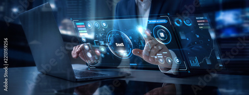 Businessman Analyzing Software as a Service and SaaS Cloud Subscriptions Data on Digital Screen, SaaS Platform Metrics, User Retention Analytics, Cloud Software Infrastructure, Application Hub
