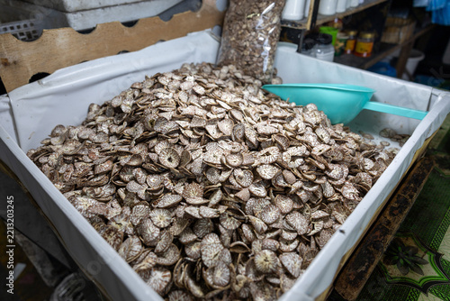 Dried areca palm fruits displayed on local farmers' market stall in Malé, Maldives. Betel chewing is traditional and common cultural practice in Maldives. Close up