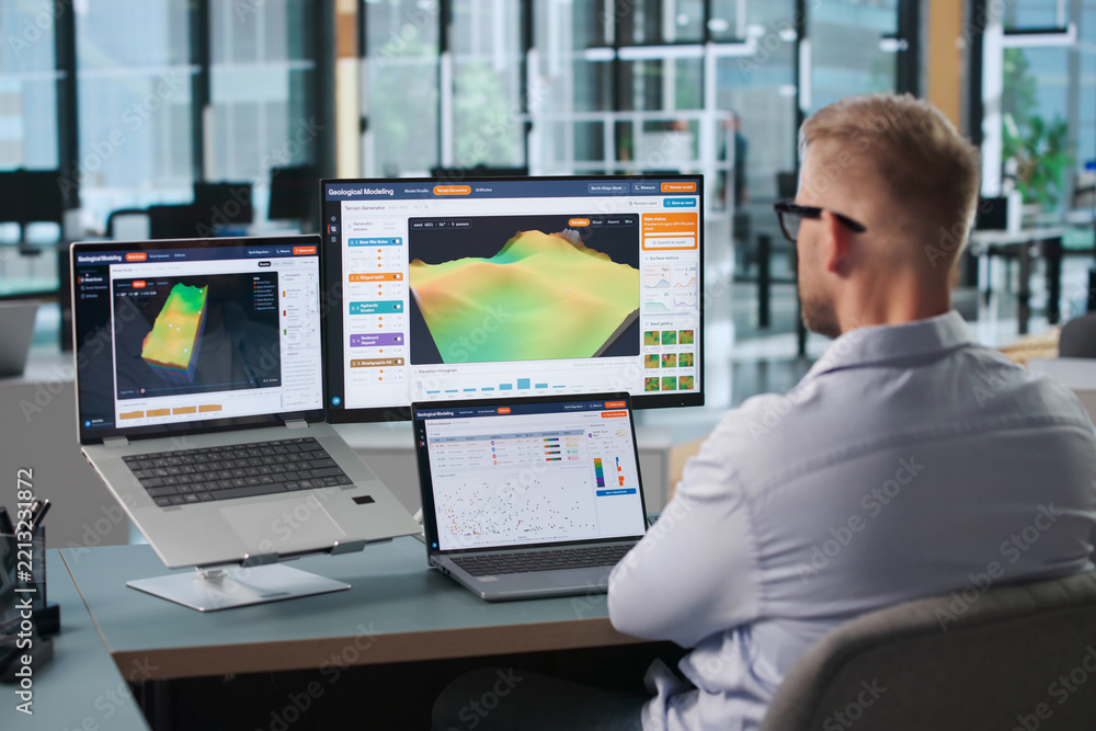 Fototapeta premium Geologist Studies 3D Subsurface Data Using Laptop