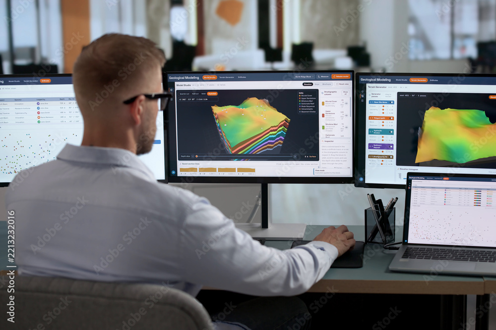 Fototapeta premium Geologist Carefully Studies 3D Subsurface Models On Laptop