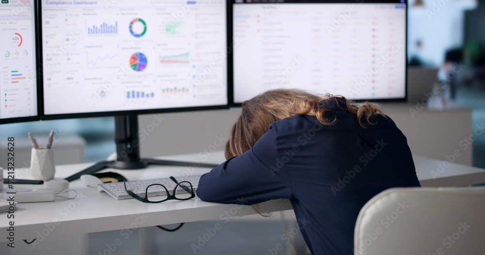 Fototapeta premium Compliance Officer Tired While Reviewing Risk Dashboard