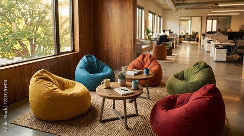 Sunlit breakroom with comfortable bean bags and city view.