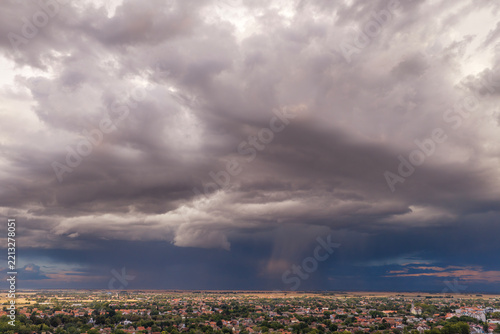 Approaching Thunderstorm, Wide aerial panorama of a residential area beneath dramatic storm clouds over serbian town of Temerin in Vojvodina, Serbia.