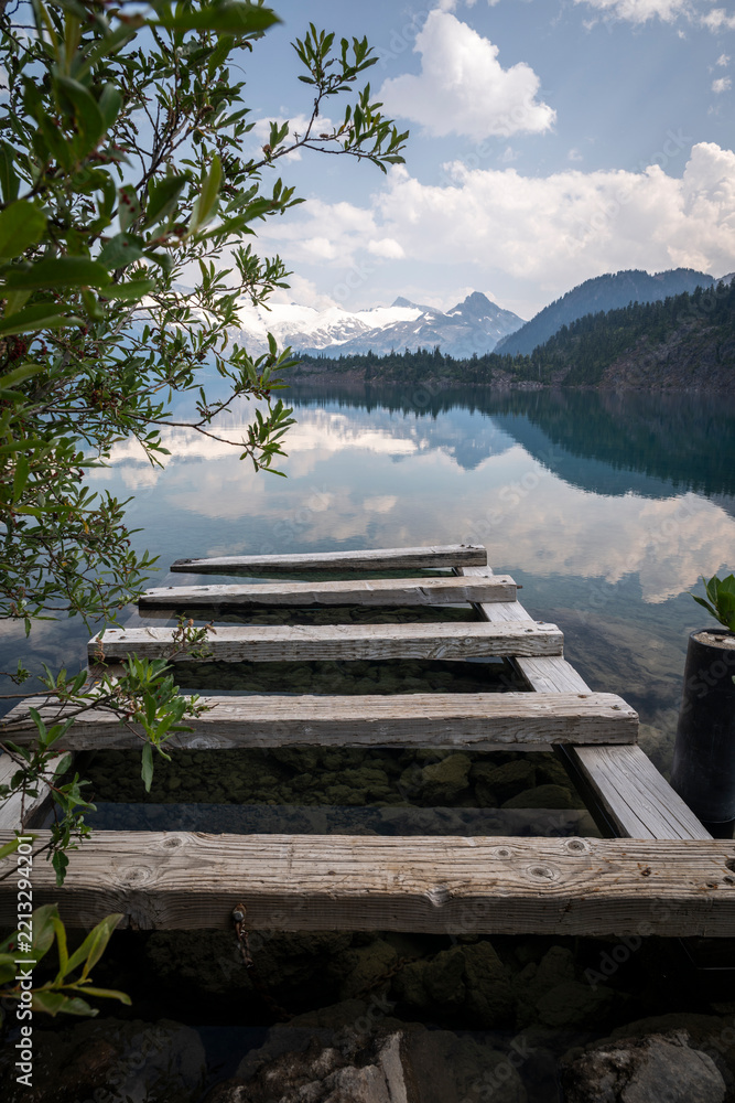 Fototapeta premium Beautiful view to old wooden dock in Garibaldi Lake, Squamish