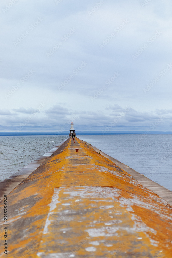 Fototapeta premium Portage Lower Entry Lighthouse Pier Amidst Cloudy Sky