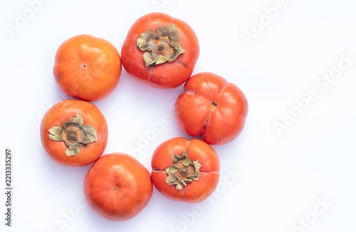 Top View of Ripe Persimmon Fruit in Circle Isolated on White Background with Copy Space