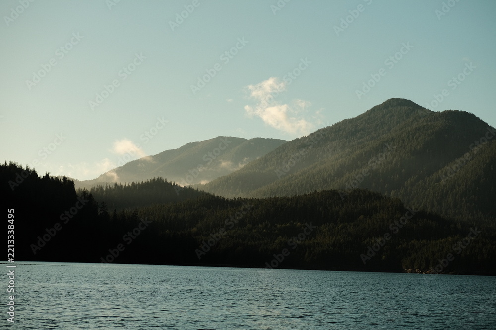 Fototapeta premium Layered blue mountain ridges fading into haze