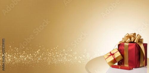 A horizontal gold background featuring red gift boxes with ribbons beside glowing bokeh sparkles and copy space.