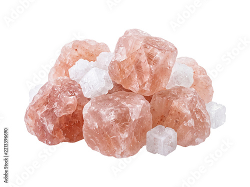Pink Himalayan salt rocks coarse natural crystals pile isolated on black background for gourmet cooking, wellness, spa, body scrub, seasoning, pure mineral salt rock background studio shot