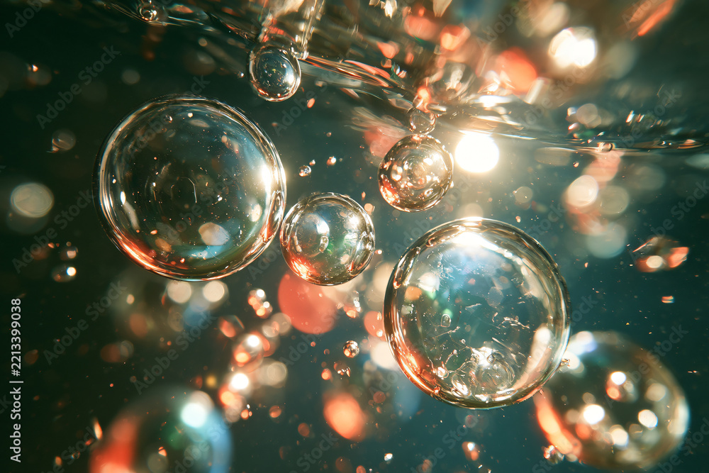 Fototapeta premium Macro underwater photography of translucent colorful bubbles floating in light