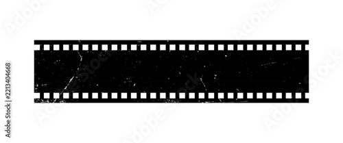 A black and white film strip with perforated edges rests on a white background