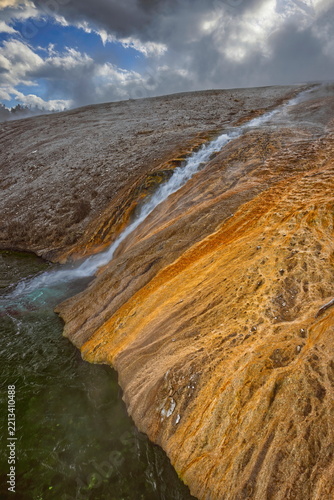 Runoff from Excelsior Geyser Crater into the Firehole River staining the banks red, at the entrance to Midway Geyser Basin. Yellowstone NP-WY-USA-028